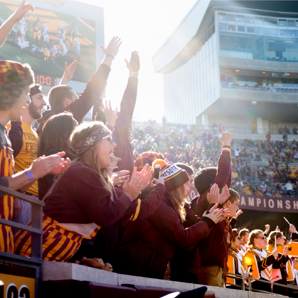 Students cheer at a football game