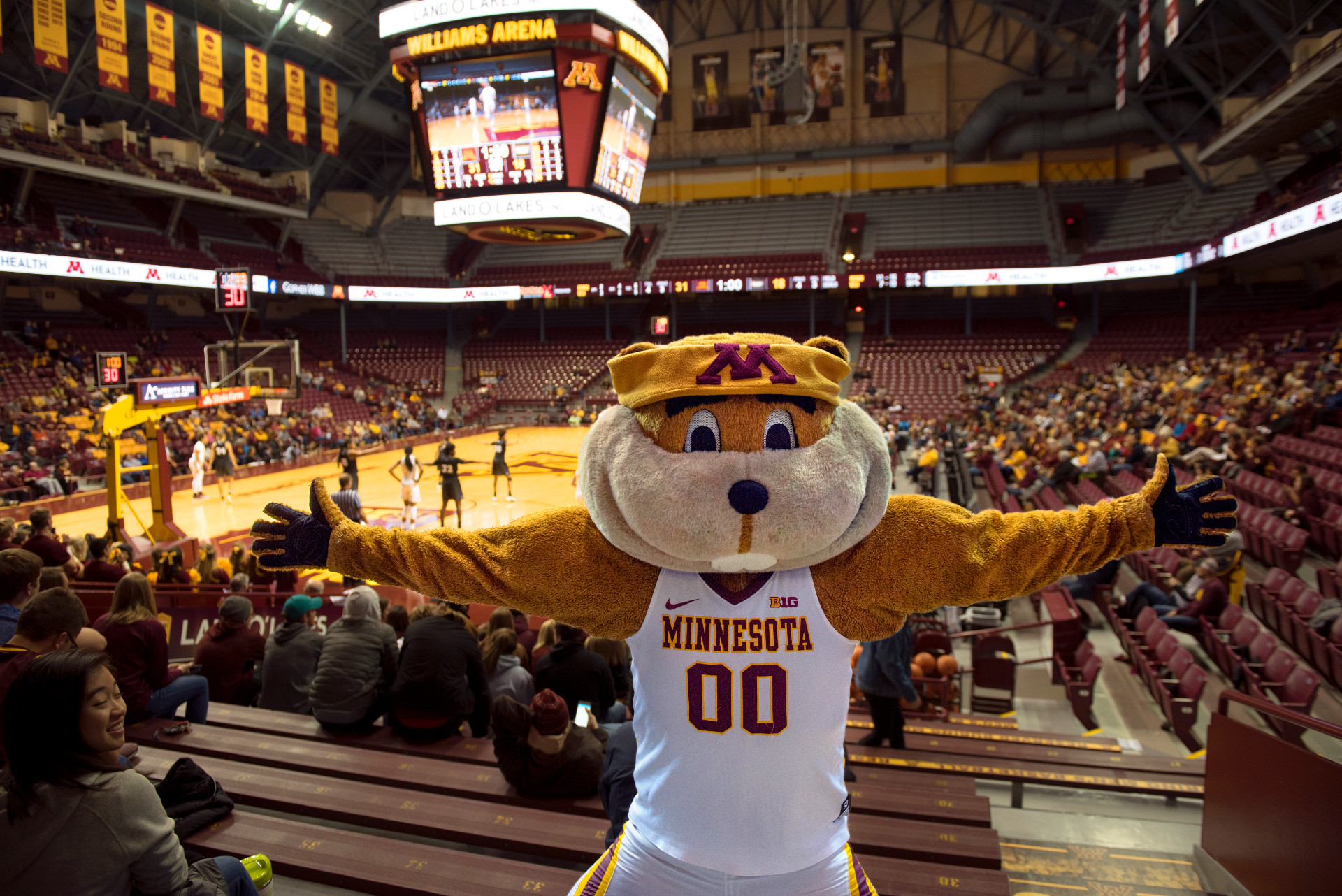 Goldy Gopher opens his arms wide at a Gopher Basketball game