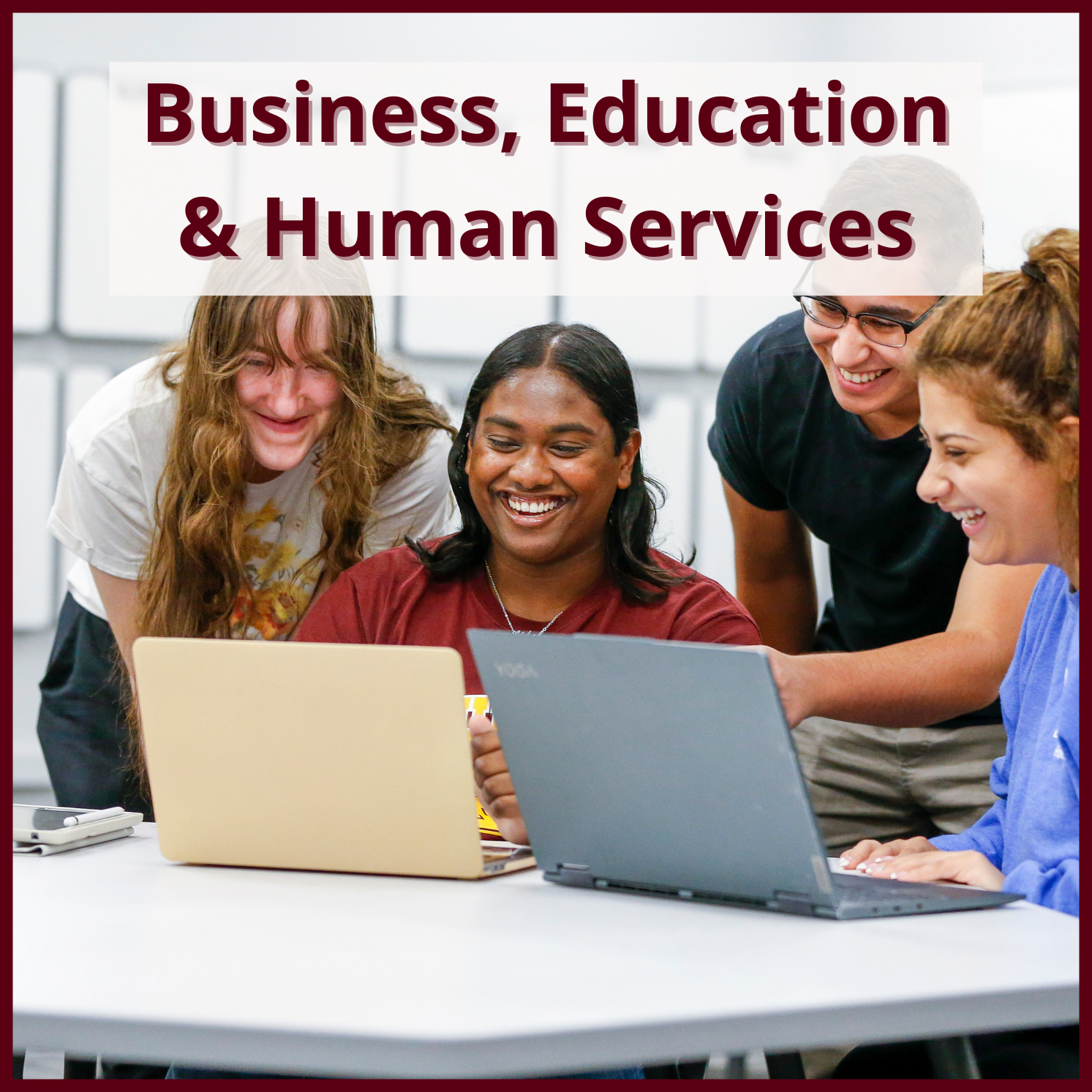 Business, Education & Human Services with a photo of students smiling while gathered around a laptop