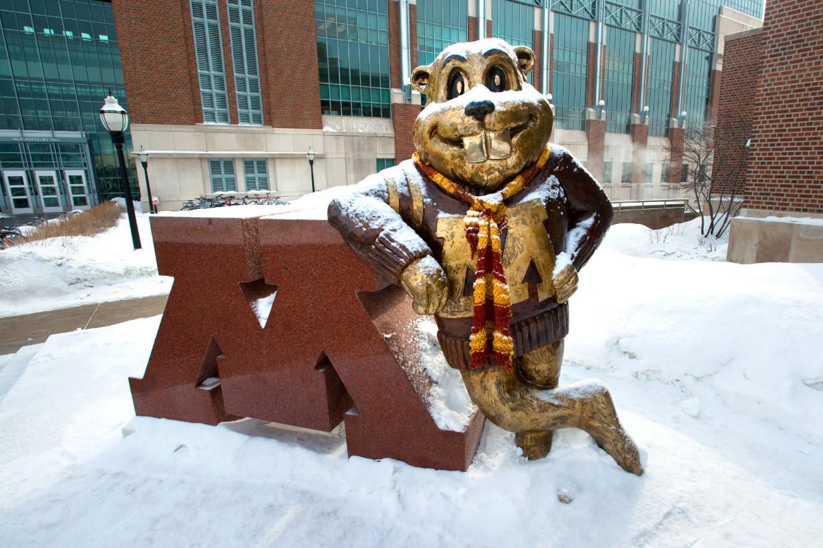 Goldy Gopher statue with a scarf and covered in snow