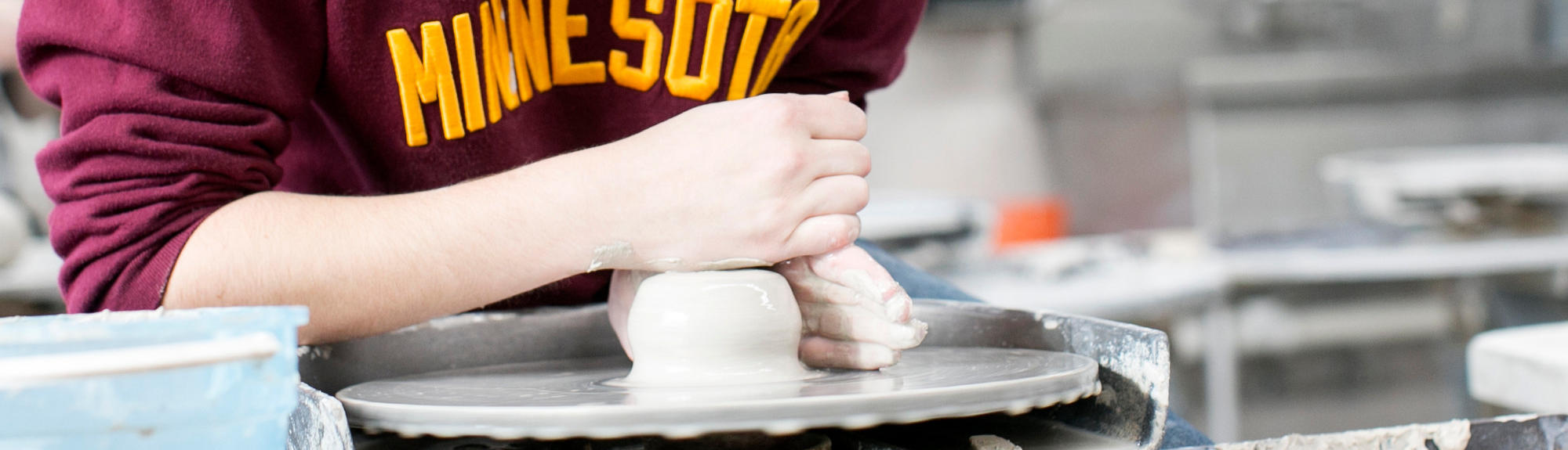 A student works on a pottery project